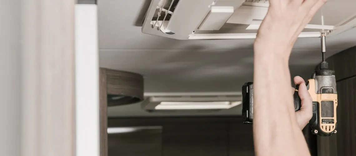 Rv Recreational Vehicle Air Conditioner Installation. Caucasian Rv Recreational Vehicle Air Conditioner Installation. Caucasian